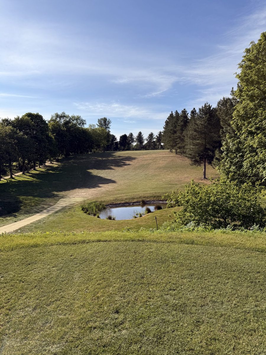 Bawburgh Golf Club — fairway looking down the course, tree-lined with bunkers and blue sky