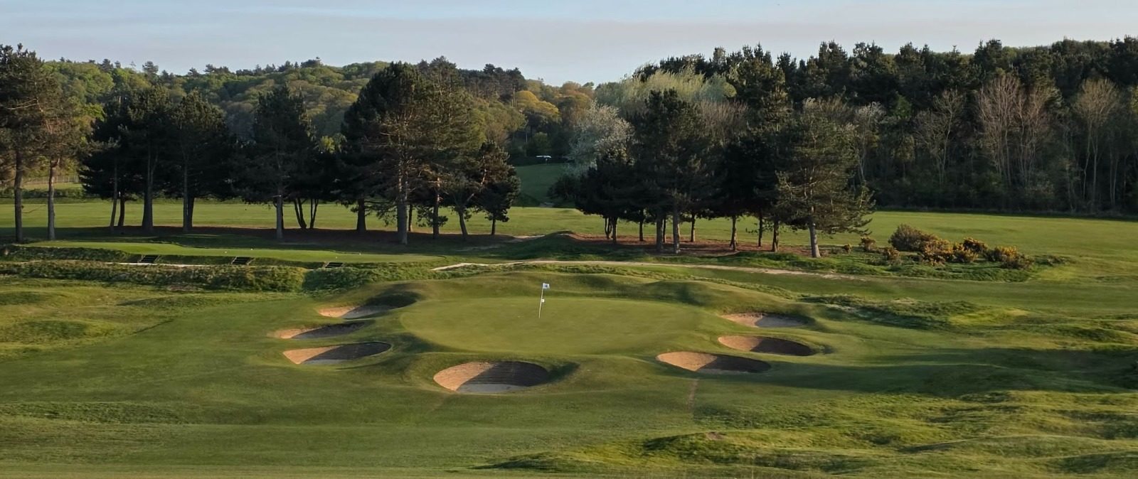 Hunstanton Golf Club — bunkers and flagstick in evening light